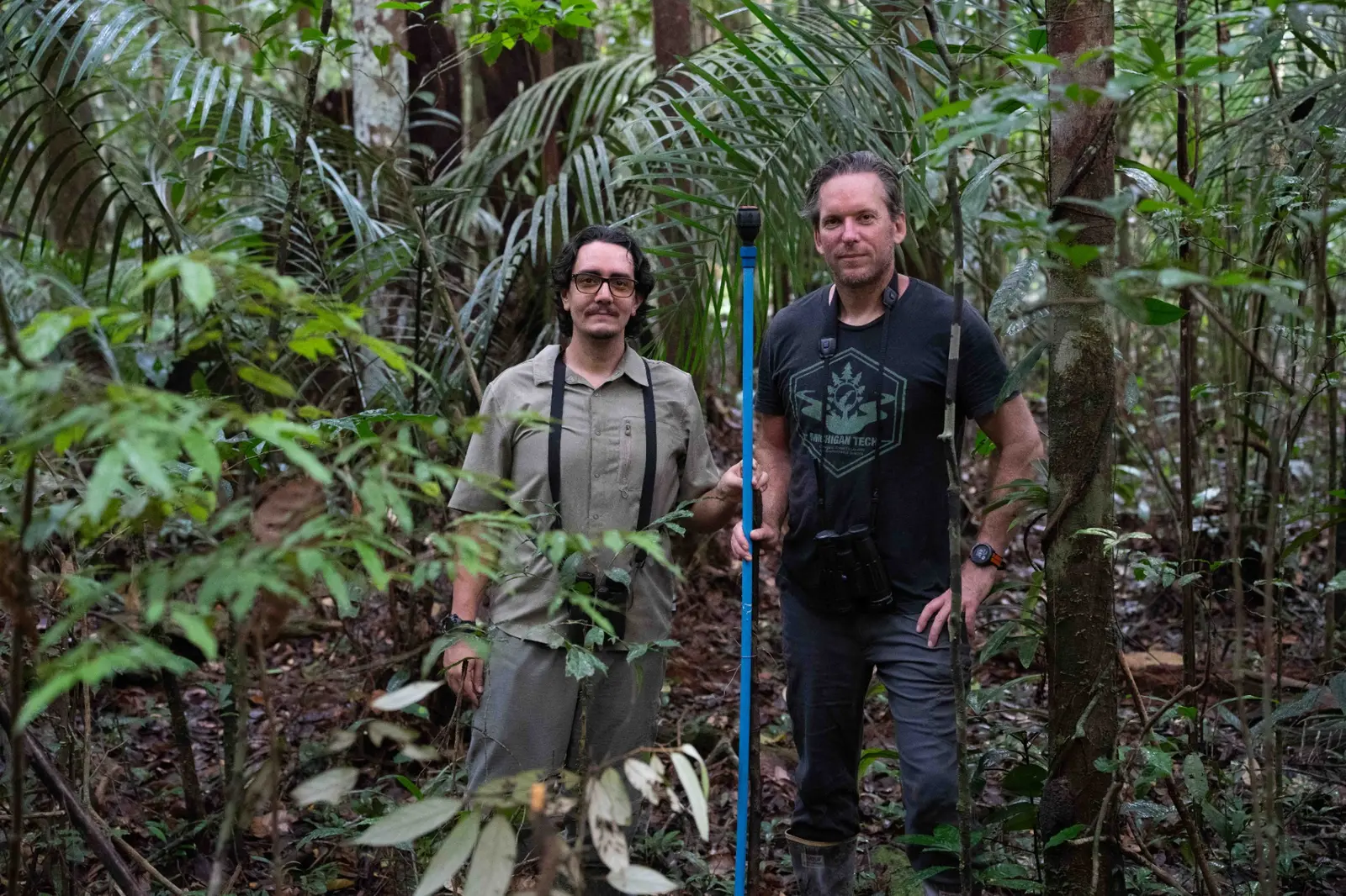 Stefano and Jared Wolfe standing together at the IRRIGA field site in the Amazon